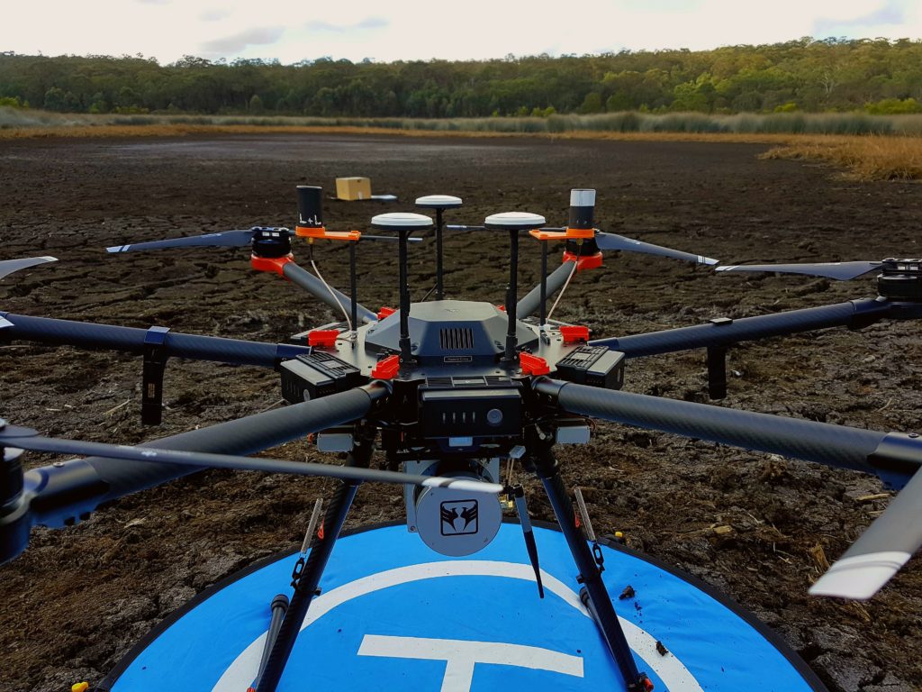 Drone on landing pad in coastal wetland (courtesy Chris Drummong, UNSW WRL).